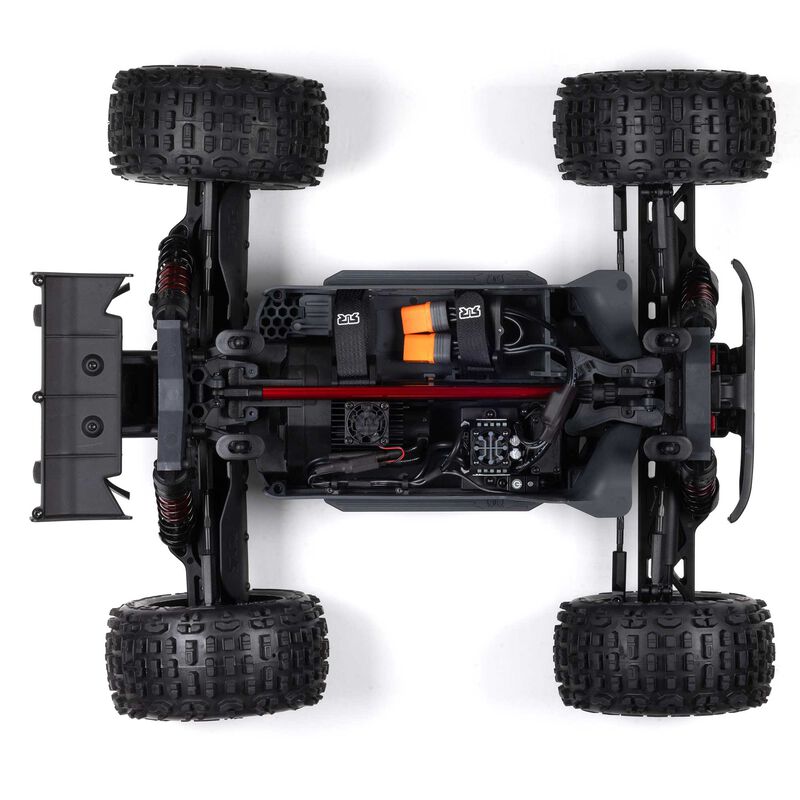 ARRMA Outcast 4X4 4S 1/10th scale 4WD stunt truck with rugged design and large off-road tires in a dynamic action shot.