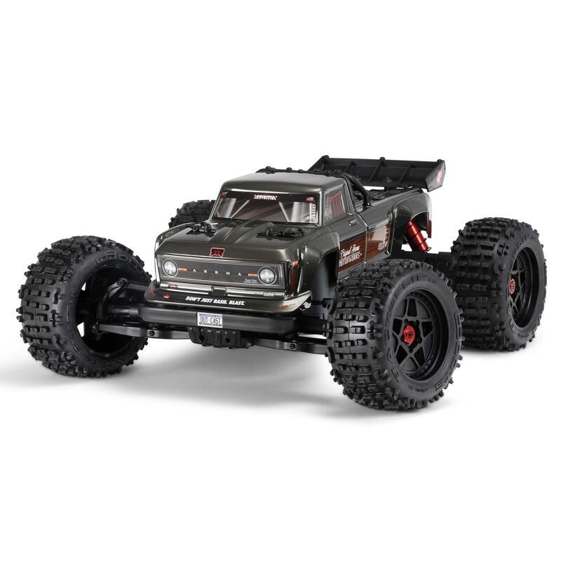 ARRMA Outcast 4X4 4S 1/10th scale 4WD stunt truck with rugged design and detailed body, ready for off-road action.