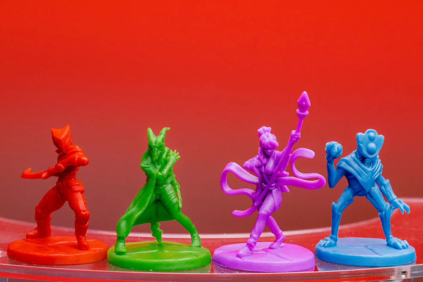 Contention Games Slay the Spire: The Board Game box with colorful artwork and game components spread out on a table.