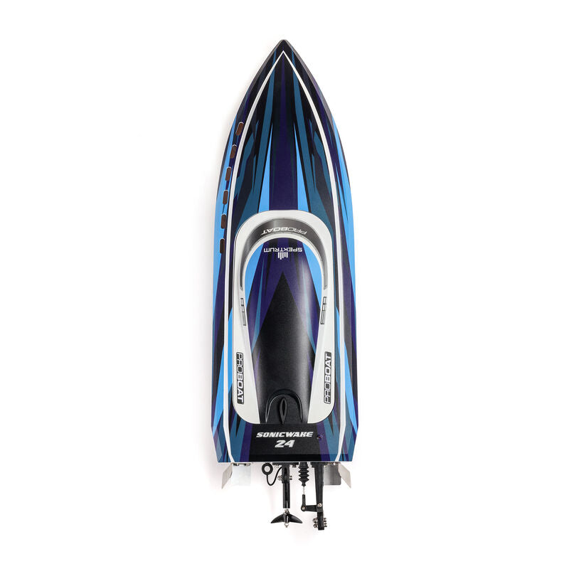 Proboat Sonicwake 24" pro boat with battery and charger, showcasing sleek design and vibrant colors on water.