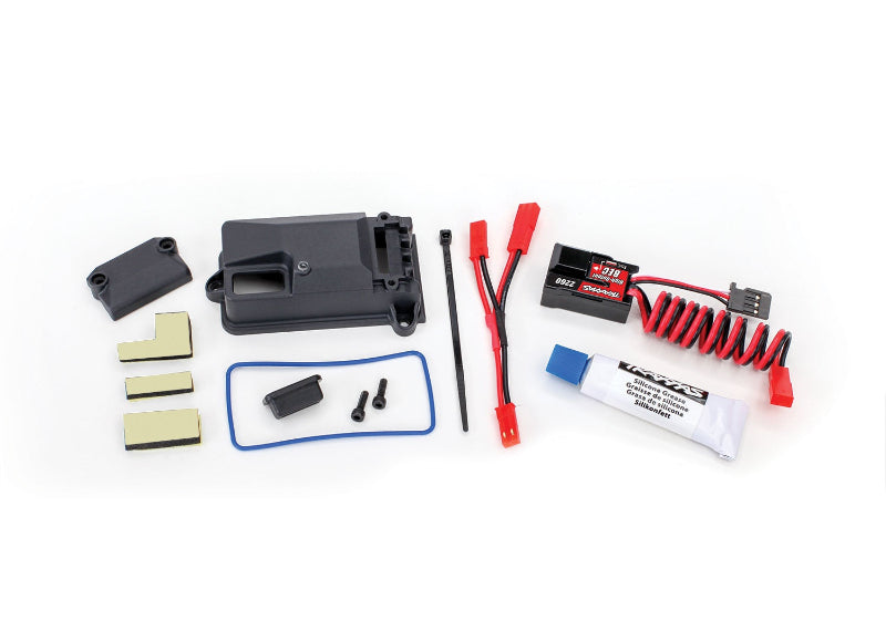 Traxxas BEC kit with box cover and seals, compact electronic speed controller part for RC models and remote control vehicles.