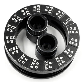 Yeah Racing aluminum round droop gauge for 1/10 touring car, showing detailed black aluminum construction and measurement markings.