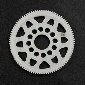 Yeah Racing 64P Delrin Spur Gear with 96 teeth, durable RC car part, shown in black on a plain background.