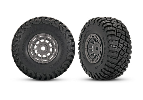 Pair of Traxxas 1.4-inch gray wheels with BFG mud-terrain tires for RC vehicles, shown with detailed tread and wheel design.