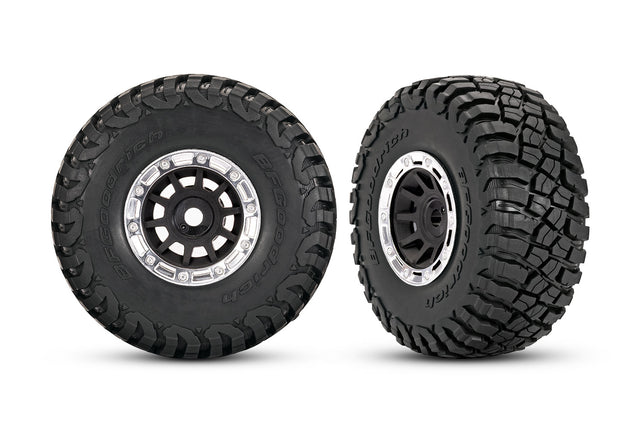 Traxxas black and chrome 1.4-inch wheels with BFG mud-terrain tires for RC trucks, shown in the image.
