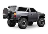 Traxxas TRX-4 Nissan Pathfinder remote control off-road vehicle rear passenger side view, detailed model with rugged design.