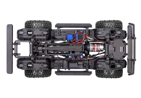Overhead view of the chassis for the Traxxas TRX-4 Nissan Pathfinder RC vehicle with detailed suspension and drivetrain components.