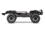 Side view of Traxxas TRX-4 Nissan Pathfinder RC crawler chassis showing detailed suspension and rugged design.
