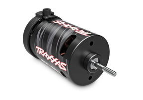 Traxxas BL-2S Brushless 3300Kv RC car motor showing black and silver cylindrical design with wiring terminals.