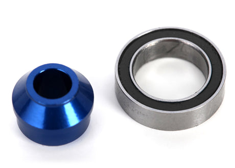 Blue aluminum bearing adapter for Traxxas remote control cars, featuring precision-machined metal construction.