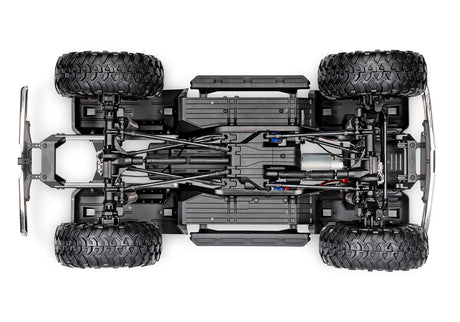Traxxas TRX-4 Ford F-150 High Trail Edition RC truck chassis bottom view showing detailed underside and suspension components.