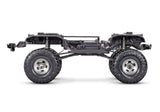 Side view of Traxxas TRX-4 Ford F-150 High Trail Edition RC truck chassis with detailed off-road design.