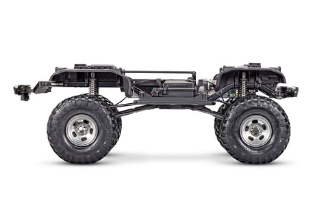 Side view of Traxxas TRX-4 Ford F-150 High Trail Edition RC truck chassis with detailed off-road design.
