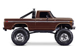 Traxxas TRX-4 Ford F-150 High Trail Edition remote control truck, side view showing detailed brown exterior and rugged design.