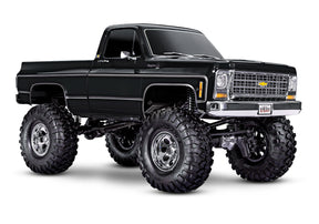 Traxxas TRX-4 Chevrolet K10 High Trail Edition RC truck with black front grille and detailed exterior, showcasing off-road design.