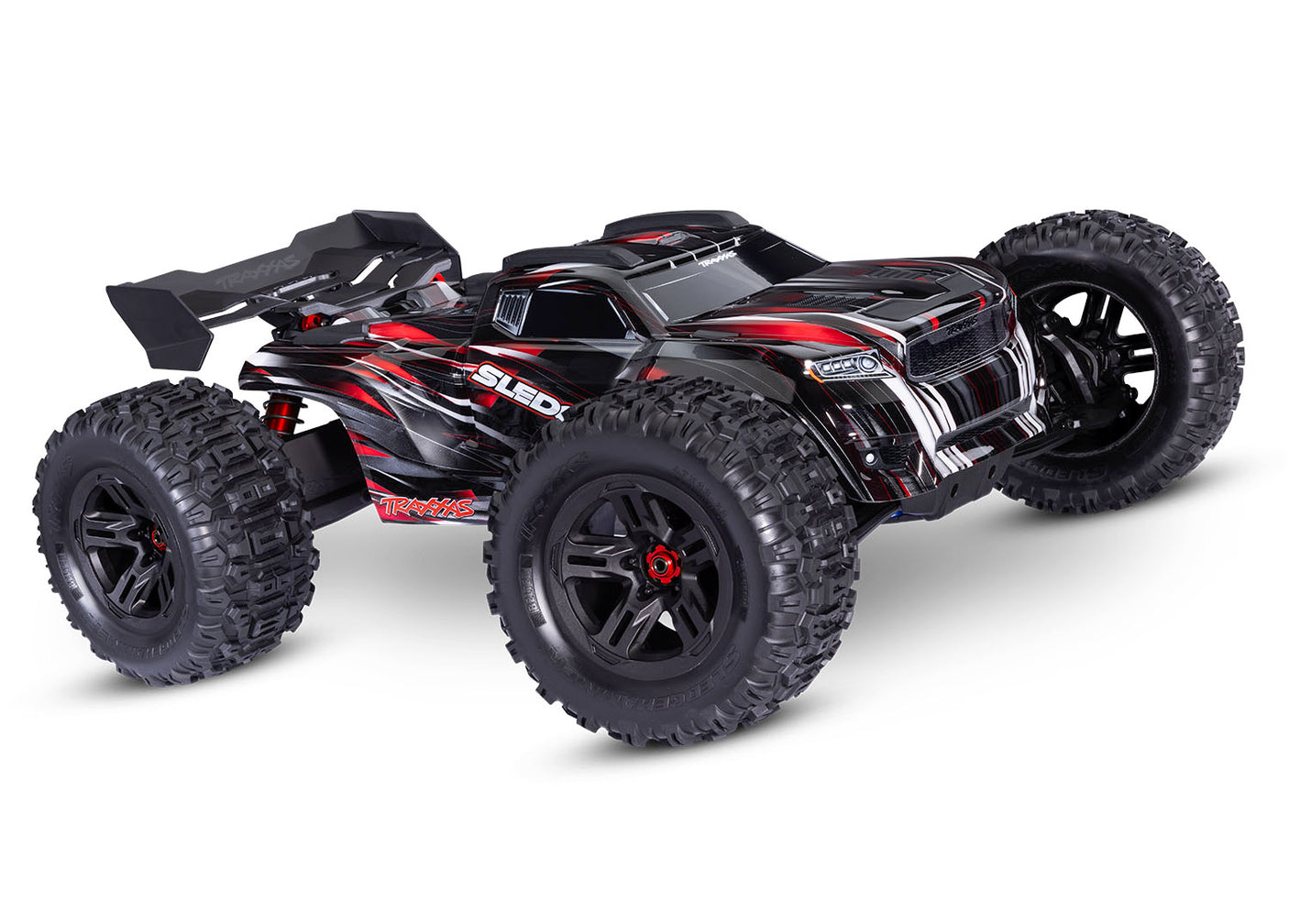 Traxxas 1/8 Sledge belted off-road RC truck showing front view with red body and RGB lighting details.