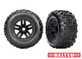 Traxxas 3.8-inch black wheels with belted Sledgehammer tires for RC trucks, showing the tires mounted on the wheels.