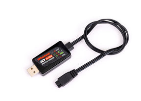 Traxxas 2-Amp USB LiPo Charger connected to a battery, showing compact design and charging port for RC batteries.
