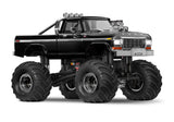 Traxxas TRX-4MT Ford F-150 RC monster truck shown from a three-quarter front view, featuring black body and detailed design.
