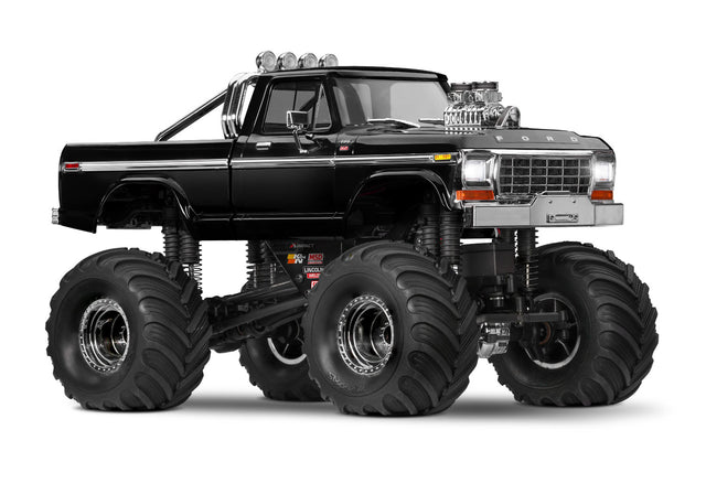 Traxxas TRX-4MT Ford F-150 RC monster truck shown from a three-quarter front view, featuring black body and detailed design.