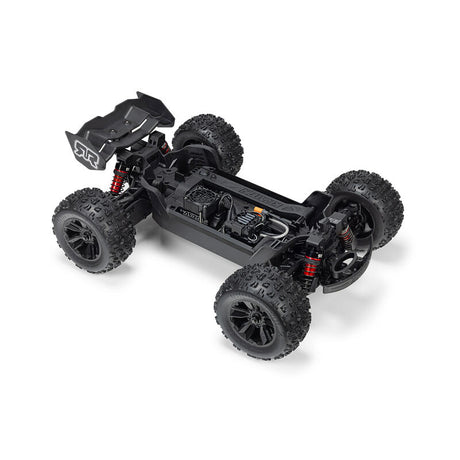 ARRMA 1/16 Mini Kraton 3S RC car with orange and black design, detailed chassis, and off-road tires.