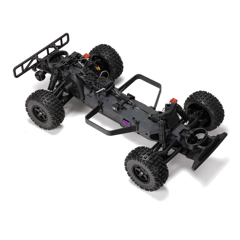 ARRMA 1/10 scale Fury 223S DSC 2WD RTR brushless short course truck on a track, showcasing its rugged design and vibrant color scheme.