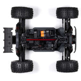 ARRMA Outcast 4X4 4S 1/10th scale 4WD stunt truck with rugged design and large off-road tires in a dynamic action shot.