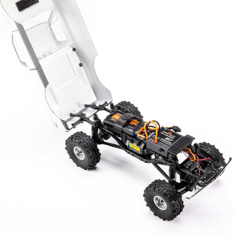 Axial 1/24 scale RC Chevrolet C10 4WD truck model from 1967-1972 with detailed body and rugged wheels, ready to run.