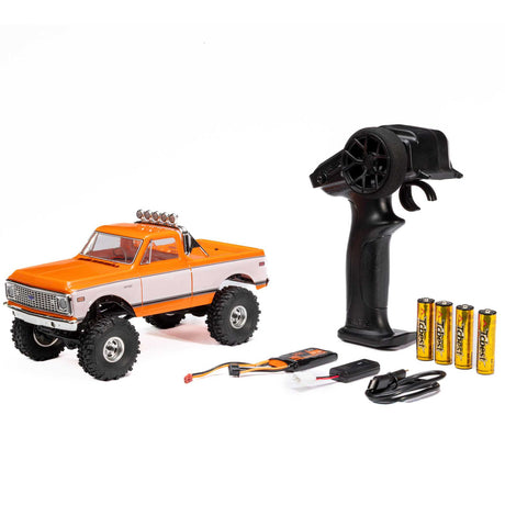 Axial 1/24 scale SCX24 Chevrolet C10 4WD truck RTR model with detailed body and off-road tires, shown from the side.