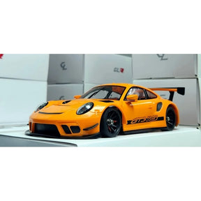 Orange GL Racing 1/28 Porsche 911 GT3 body with 98mm wheelbase, shown on a white background.