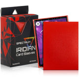 Spectrum Iridian card sleeves shown with their retail box. The set includes a red textured sleeve standing upright, a partially opened box showing purple card sleeves inside, and the black-and-red branded packaging.