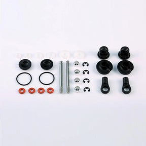 LC Racing L6115 rear shock accessories, close-up of black shock mounting hardware and adjustment components.