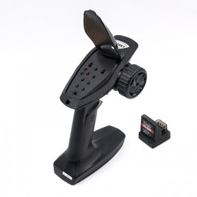 LC Racing FS-G4P 2.4GHz transmitter and receiver set with control sticks and antenna for RC cars.