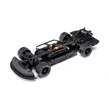 Losi 1/12 scale asphalt late model 2s AWD RC race car with detailed body and racing decals on a track surface.