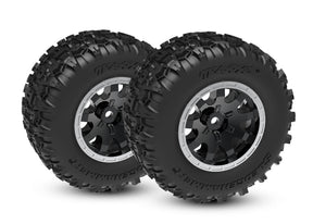 Traxxas Mini Maxx and XRT 4-inch front wheels with tires for remote control off-road vehicles, showcasing the wheel design and tread pattern.