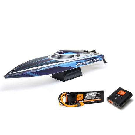 Proboat Sonicwake 24" remote control boat with battery and charger, showcasing sleek design and vibrant colors.