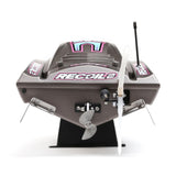 Proboat Heatwave Recoil 2 V2 26" self-righting boat with sleek design and vibrant colors on water surface.