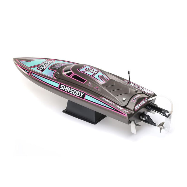 Proboat Heatwave Recoil 2 V2 26" self-righting boat, showcasing sleek design and vibrant colors on the water.