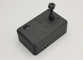 Reflex Racing RRE011 tire gluing machine for 1:28 scale RC cars, shown with parts and tools for precise tire assembly.