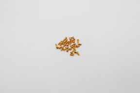 Reflex Racing RX28A-13 gold screw kit for RC car parts, featuring shiny gold screws and hardware for RC vehicle assembly.
