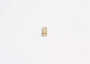 Reflex Racing RX28A-33-HS G2 gold hard center spring for RC cars, showing the coil spring with a gold finish.