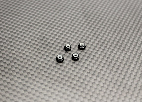 Reflex Racing RX525 aluminum black wheel nuts for RC cars, close-up of durable, lightweight RC car parts with a sleek finish.