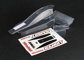 Traxxas Bandit clear RC car body with wing, lightweight plastic shell for remote control racing vehicles.