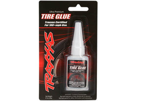 Traxxas Ultra-Premium Tire Glue bottle with applicator tip, designed for durable tire assembly and sealing in RC vehicles.