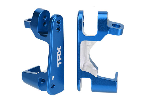 Blue aluminum caster blocks for Traxxas remote control cars, showing left and right components with a sleek metallic finish.