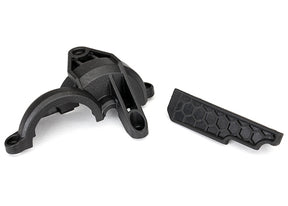 Traxxas rear gear cover for RC vehicle, black plastic with gear opening, designed to protect the rear gear assembly.