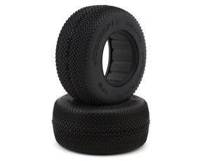 Pair of JConcepts Relapse Short Course Tires in green for RC cars, showing tread pattern and vibrant green rubber.