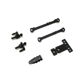 Kyosho Mini-Z MR-04 suspension small parts for RC car, close-up of tiny components for model car maintenance.
