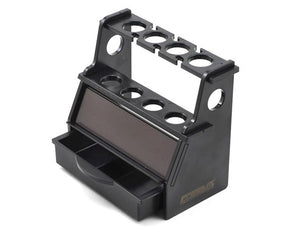 ProTek RC shock stand for 1/10 and 1/8 scale RC cars, black plastic with adjustable supports, used for maintenance and setup.