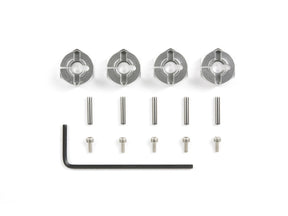 Set of four Tamiya 6mm aluminum wheel hubs for RC cars, durable lightweight metal with precise fit and finish.